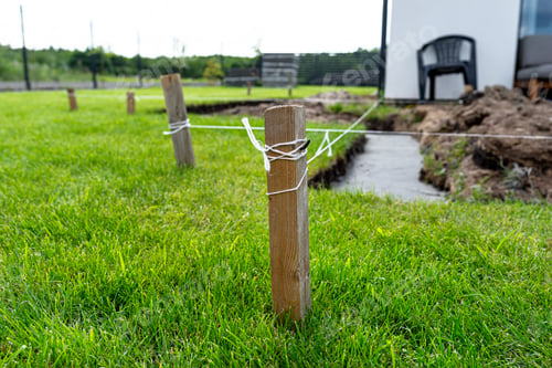 Preview: Foundation footings poured in a ditch in the yard, building a terrace in the backyard.