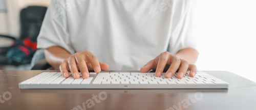 Preview: Man working at home, hands pressing computer keyboard, working at home