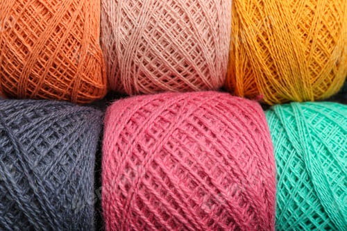Preview: Clews of knitting threads as background, top view. Sewing stuff