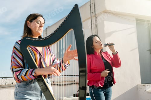 Preview: Harp and voice duo performing on the roof of the building