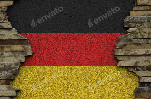 Preview: Germany flag depicted in paint colors on old stone wall close up