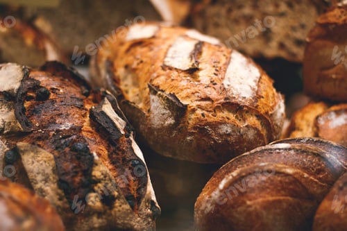 Preview: Breads on a showcase in a French bakery. Soft focus, close up view.