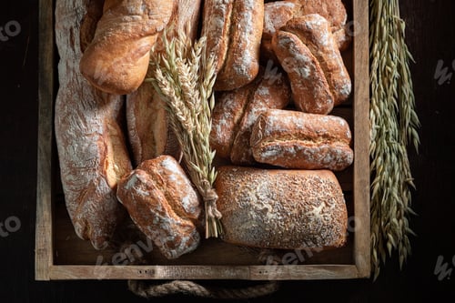 Preview: Mix of crunchy buns and baguettes freshly baked in bakery