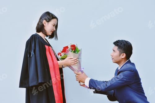 Preview: Graduation Surprise: Young Woman Gets Flowers from Partner