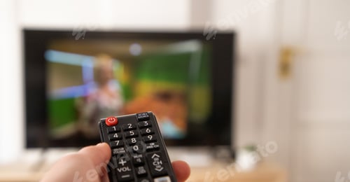 Preview: hand with remote control for tv set
