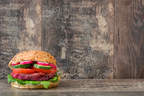 Preview: Healthy vegan beet burger resting on rustic wooden table