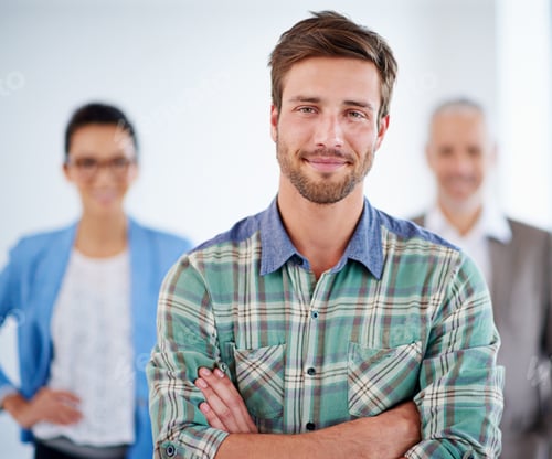 Preview: My professional life suits me. Confident young man with people in the background.