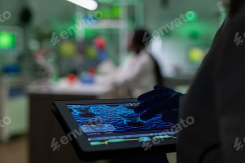 Preview: Selective focus on chemist researcher doctor hands using tablet computer
