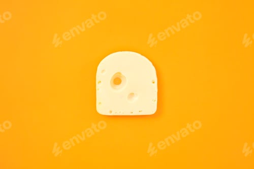 Preview: Piece of cheese on orange color background