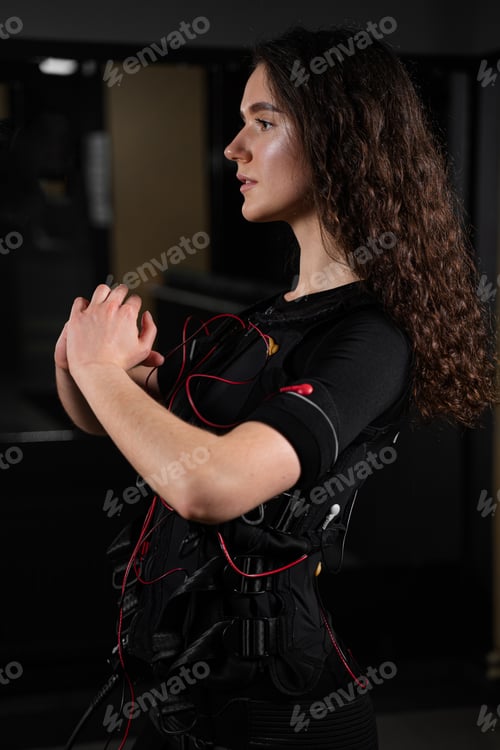 Preview: EMS workout session performed by woman in gym