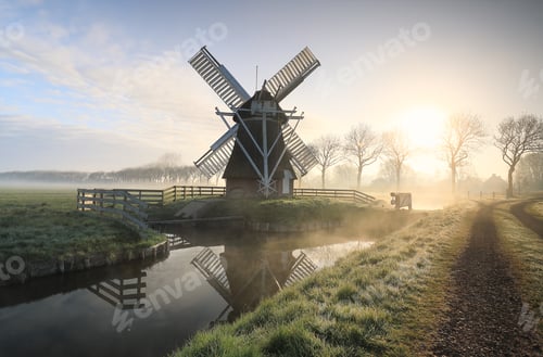 Preview: windmill in fog by river and road