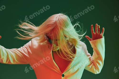 Preview: Dynamic fashion portrait of a person with flowing hair against a vibrant green background