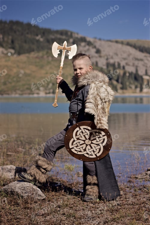 Preview: Young viking warrior in the Wolfskin cloak with wooden shield and axe