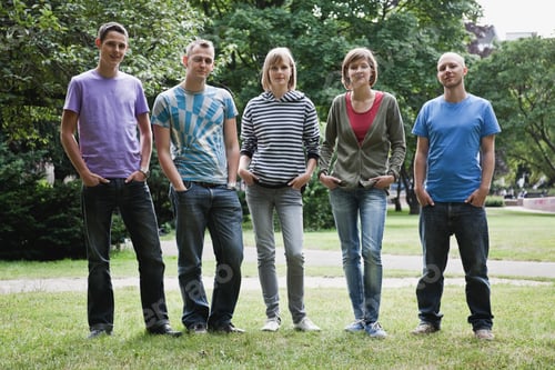 Preview: Germany, Berlin, Man and woman standing in row with hands in pocket