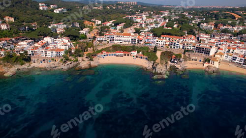 Preview: Aerial view of Costa Brava paradise beach in summer and people swimming in clear waters