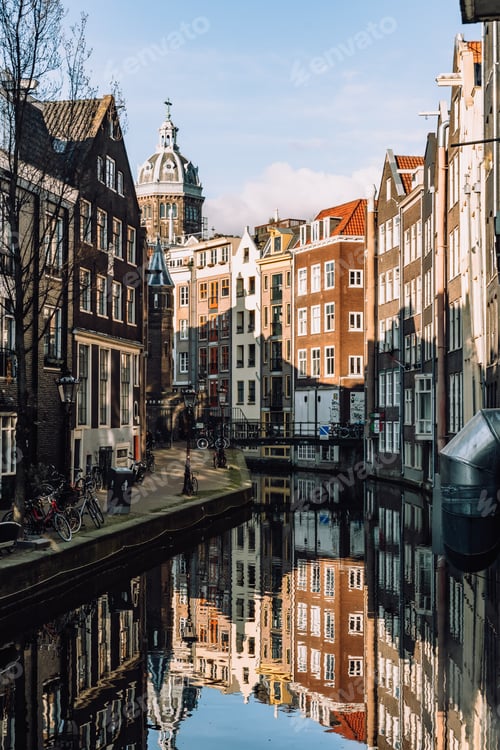Preview: Amsterdam canals with storehouses and cathedral netherlands holland
