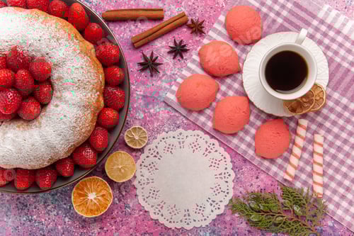 Preview: top view sugar powdered pie strawberry cake with tea and cakes on a pink background biscuit pie