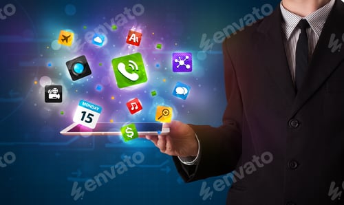 Preview: Young Businessman Holding A Tablet With Modern Colorful Apps And Icons