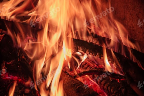 Preview: Firewood burning in corner of house.