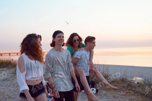 Preview: Friends enjoying a beach sunset together