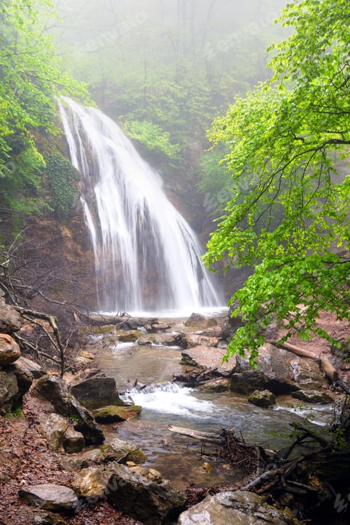 Preview: Waterfall flows in mountain forest