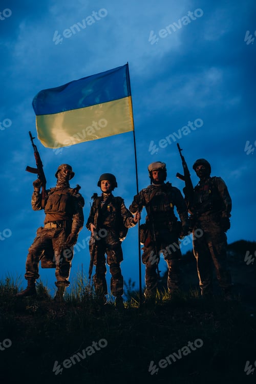 Preview: Company of Ukrainian armed forces with blue and yellow flag in the evening