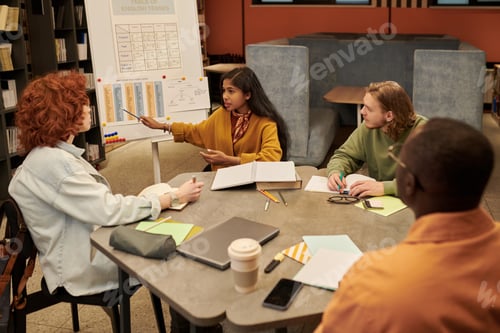 Preview: Multiethnic Teenagers Collaborating during Group Study Session in Library