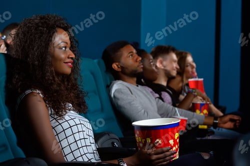Preview: Young African woman watching a movie