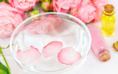 Preview: cosmetics with rose flower extract. Selective focus.