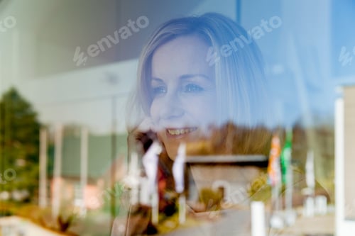Preview: Woman looking through window
