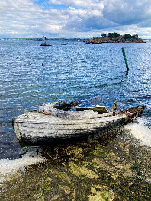 Preview: Wrecked boat on the shore in the river