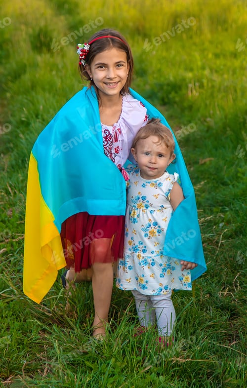Preview: Child with Ukrainian flag patriot stop war. Selective focus.
