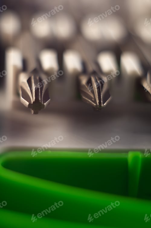 Preview: Vertical closeup shot of different sizes of screwdrivers in a toolbox