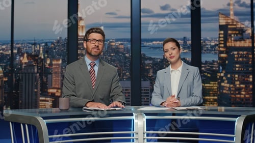Preview: Friendly anchors smiling evening television channel closeup. Newsreaders talking