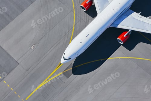 Preview: Aerial view of airport. Airplane taxiing to runway before take off.