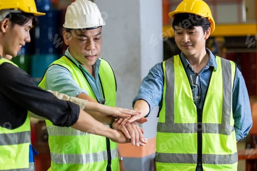 Preview: Success teamwork concept. engineer factory group joining hands
