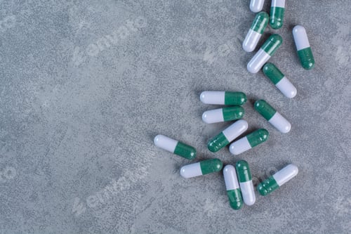 Preview: Bunch of medical capsules on marble background