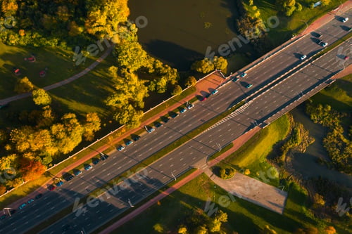Preview: View from the height of the road with cars near the autumn Park