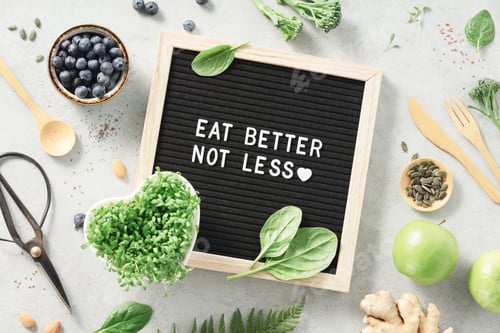 Preview: Eat better not less letter board quote flat lay