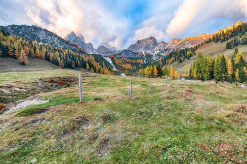 Preview: Fabulous view of mountains and valleys with larch forest and wonderful sky are located in Filzmoos