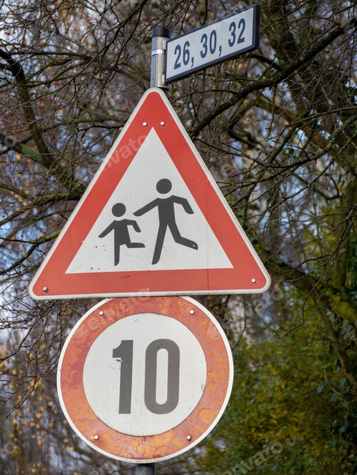 Preview: Closeup shot of a street signs has number 10, child and parent and three numbers