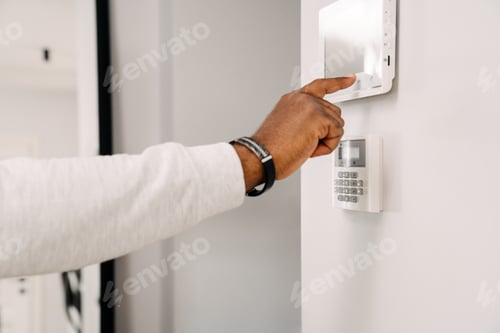 Preview: Black man's hand opening door with security code