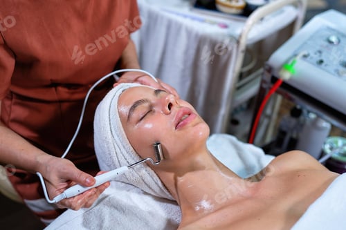 Preview: Beautiful young woman lying down on massage beds at luxury massage and spa and wellness center