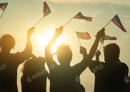 Preview: People raising USA flags in the air.