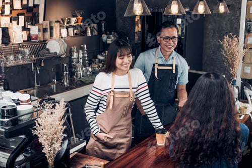 Preview: Asia barista waiter and waitress take order from customer in coffee shop