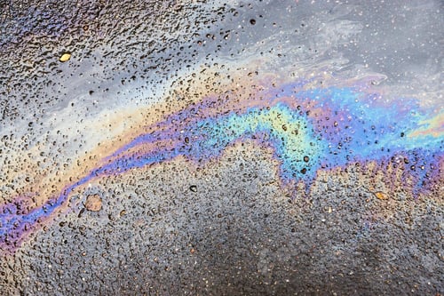 Preview: The Abstract Textured Pattern From Iridescent Spots Of Oil Or Gasoline On Asphalt
