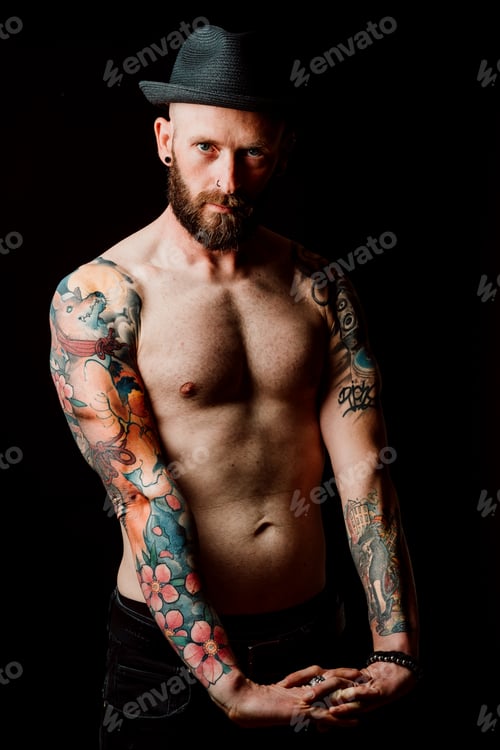 Preview: Young shirtless bearded guy with tattoos