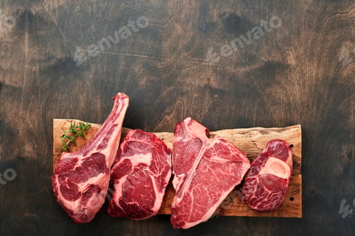 Preview: Raw prime steaks. Variety of fresh black angus prime meat steaks T-bone, New York, Ribeye, Striploin
