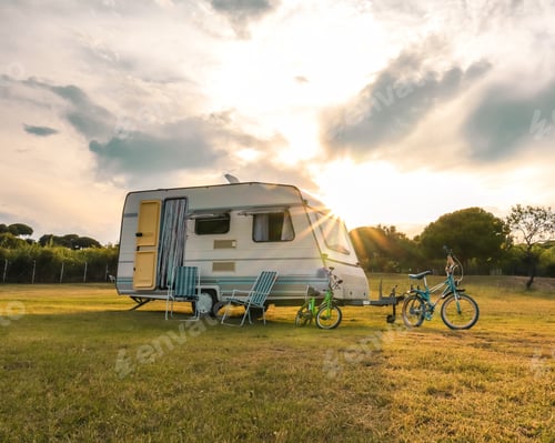 Preview: Bicycles parked near a van in the field