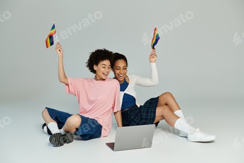 Preview: Joyful celebration of diversity as two friends wave flags and connect online together